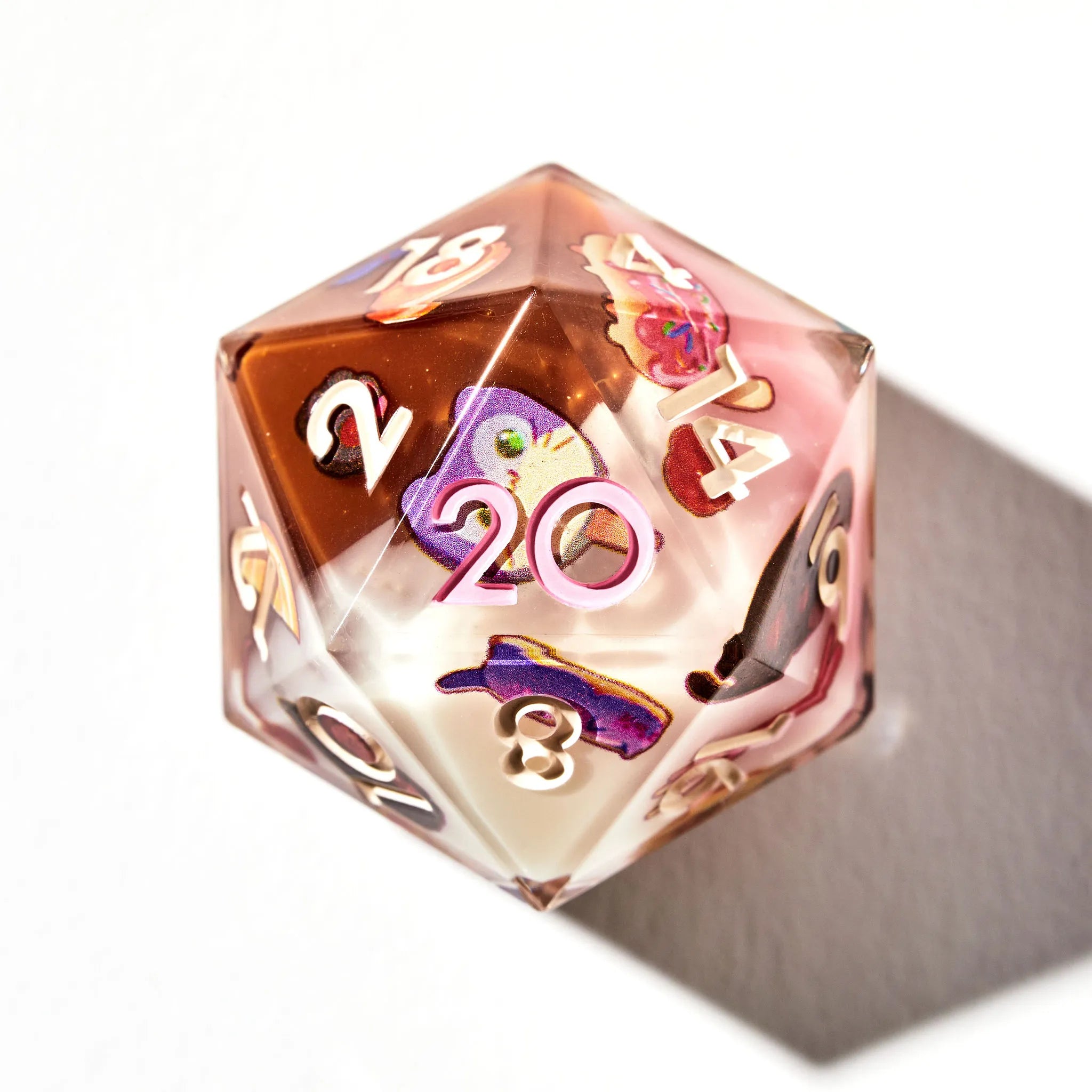 Neapolitan Colored D20 for DnD with Cat Themed Pastry Designs on a White Background