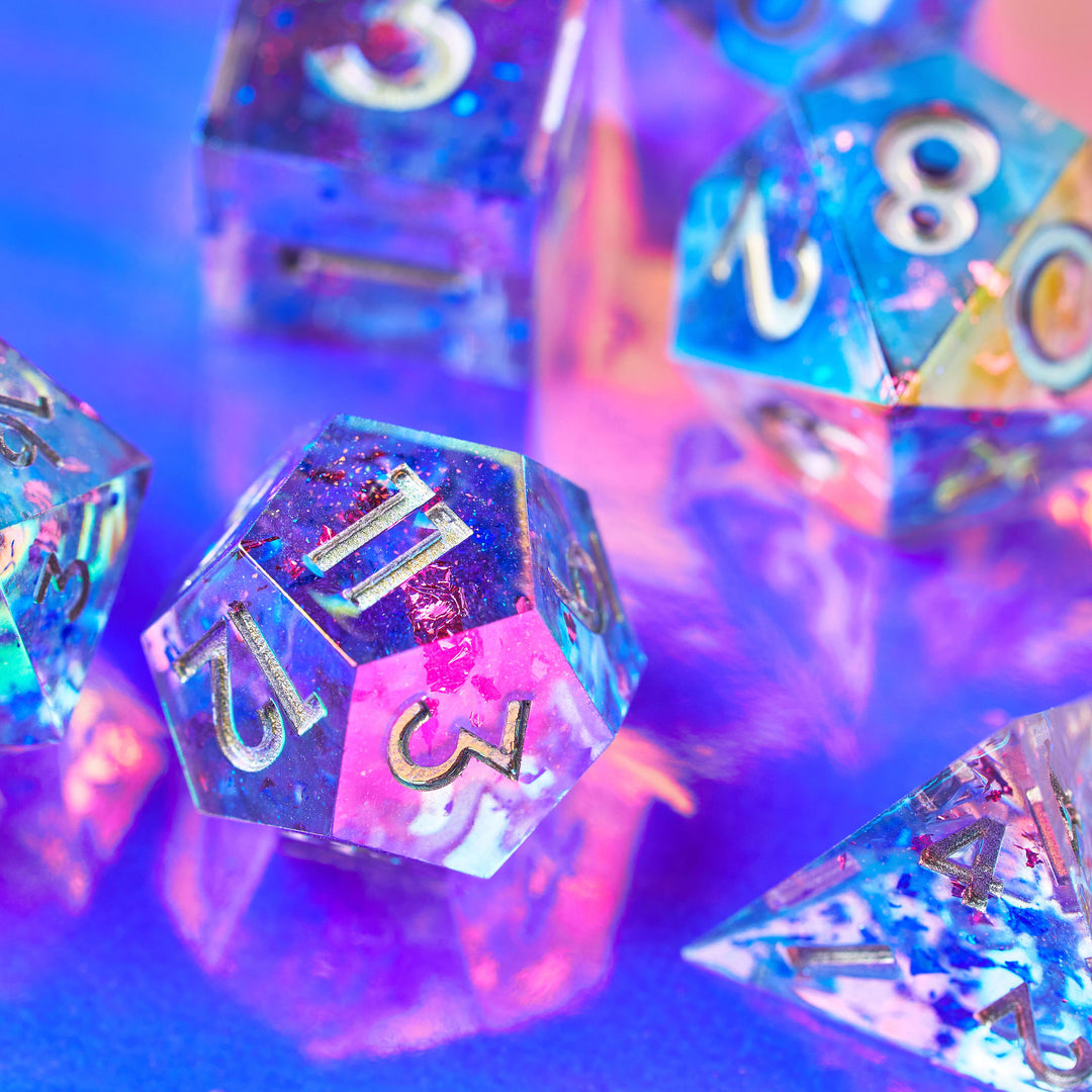 Shiny pink & blue DnD Dice on blue glass | Dispel Dice