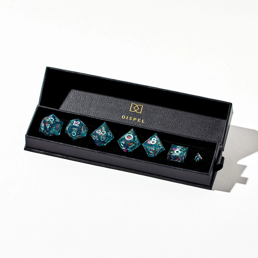 Blue DnD 7-Piece Dice Set in its Packaging with Gold-Bordered Cephalopod Stickers