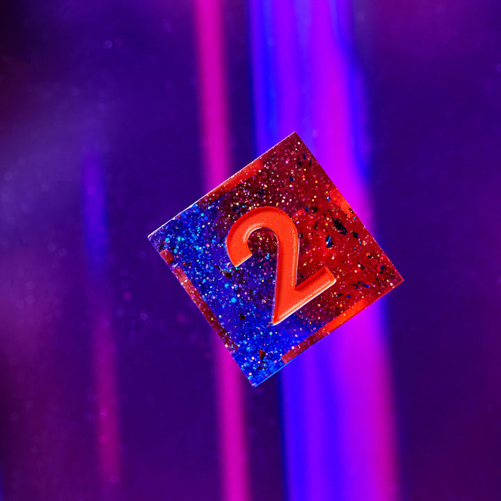 Blue & Red D6 on a purple background | Dispel Dice