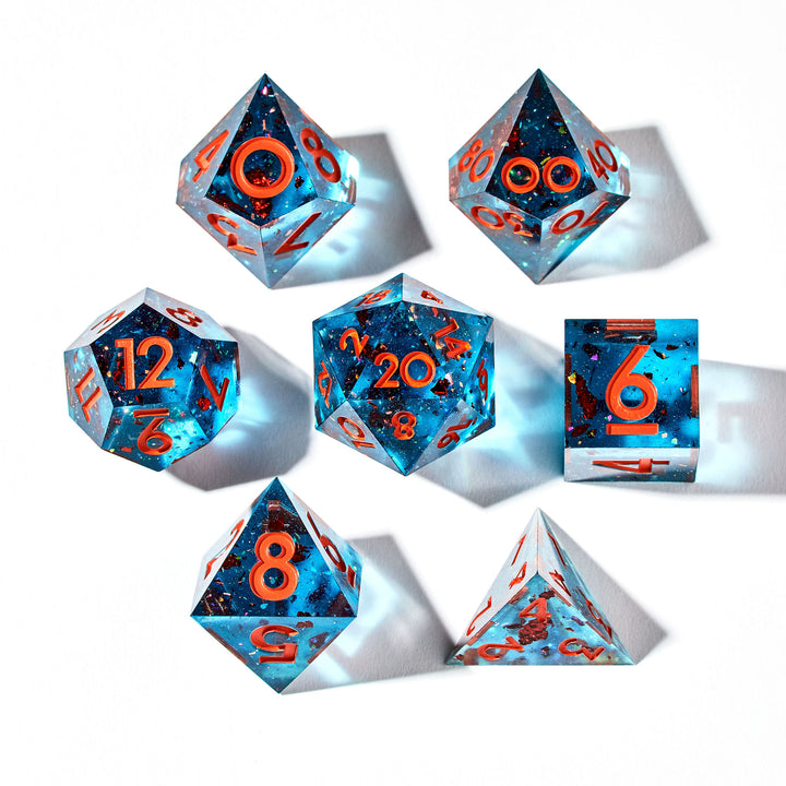 Blue gaming dice set w/ orange flakes and numbering on a white background | Dispel DIce