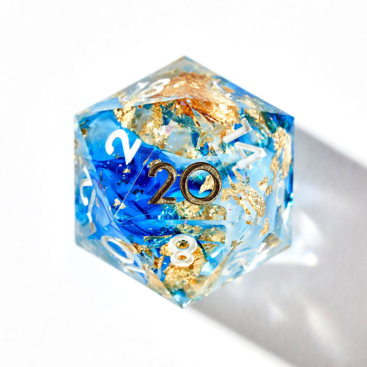 OPTIMIZE_BACKUP_PRODUCT_Blue D20 with gold flakes and with gold and white numbering on a white background.