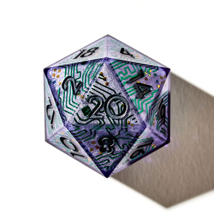 Close up of a purple D20 with circuit board like designs