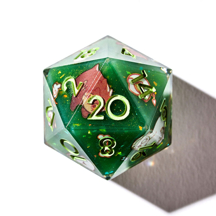 Close up of a green D20 with bear owl designs