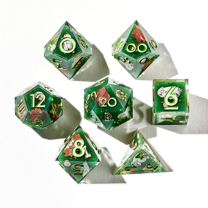 Close up of a green dice set with bear owl designs