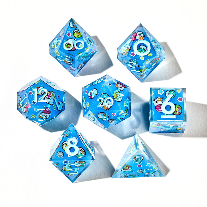 Close up of a light blue dice set with light blue numbers and gachapon capsules