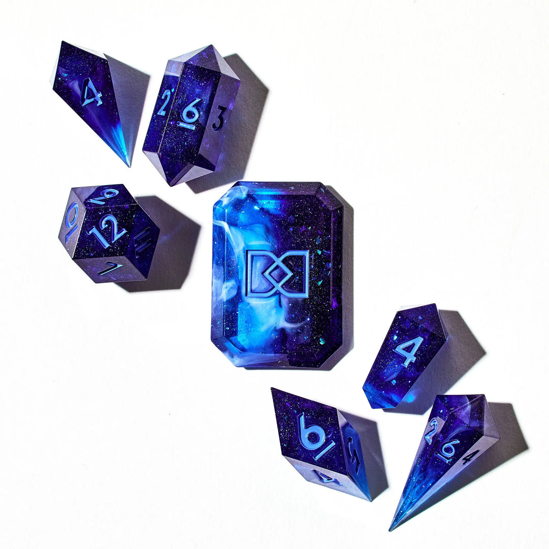 Deep and Light Blue Mixed Jewel Shaped Dice Set on a White Background