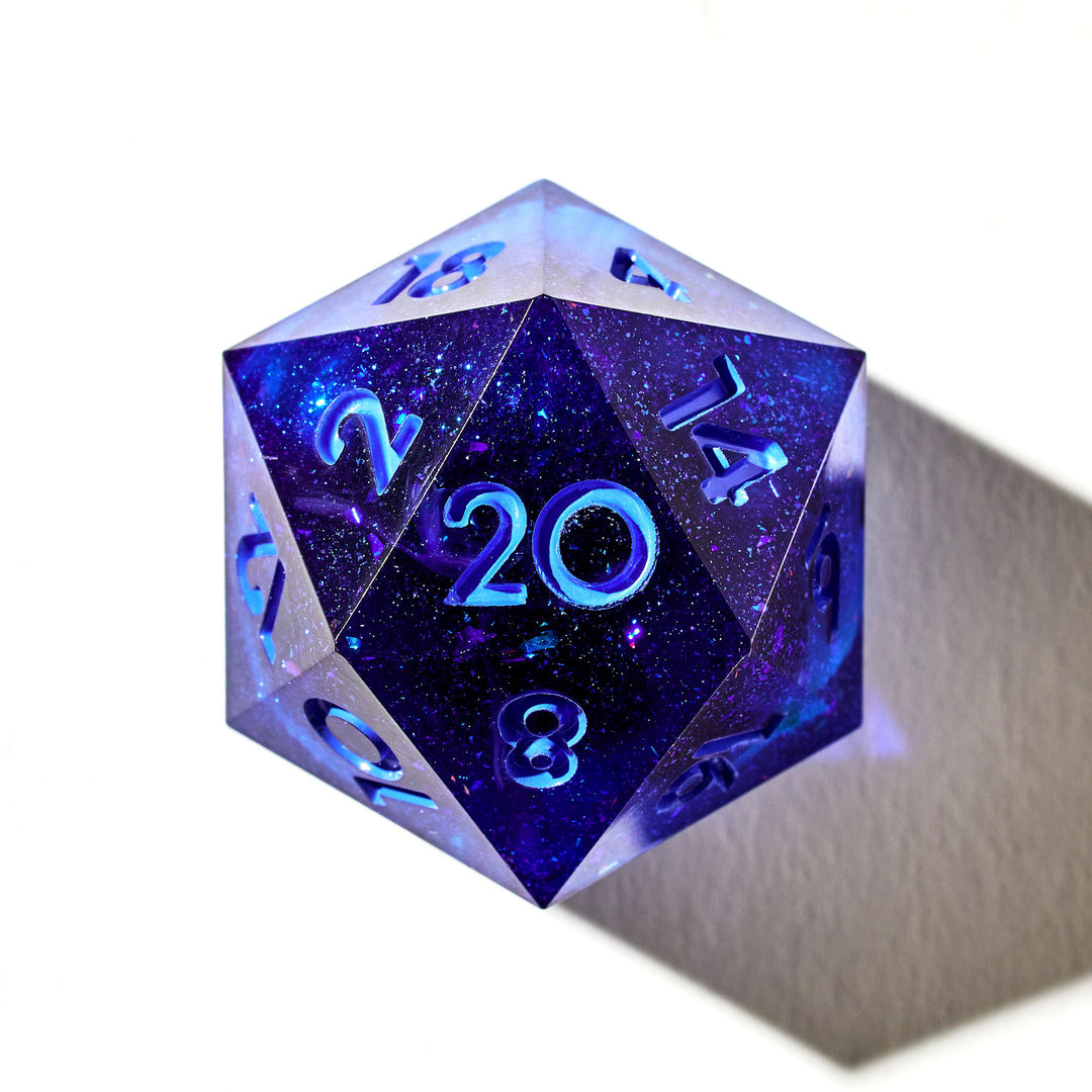 Close up of a blue D20 