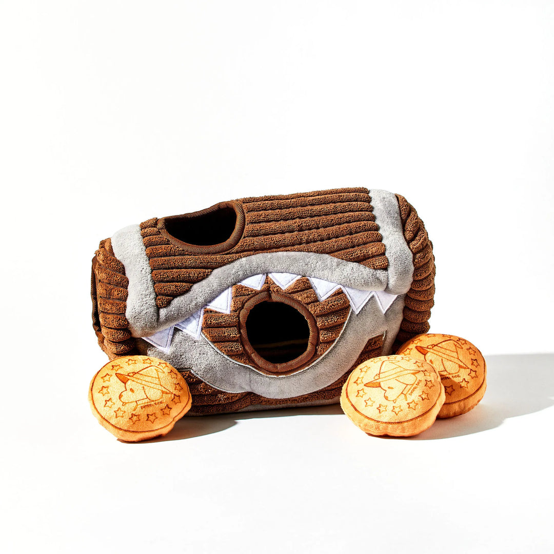 A Brown Plush that looks like a Mimic Chest with 3 Plush coins with a dog design all on a White Background
