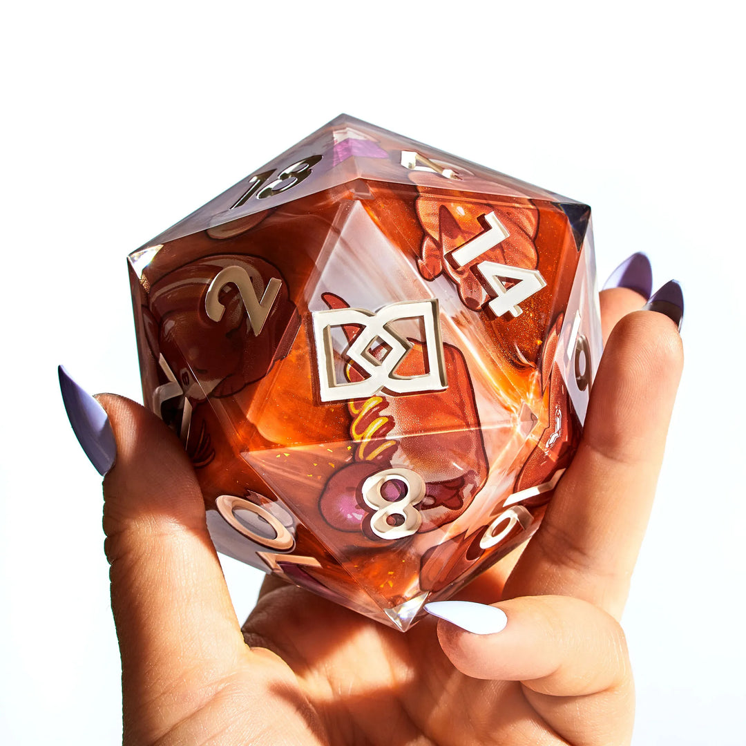 A Hand Holding a 95mm DnD D20 with Dog-Themed Pastry Designs on a White Background