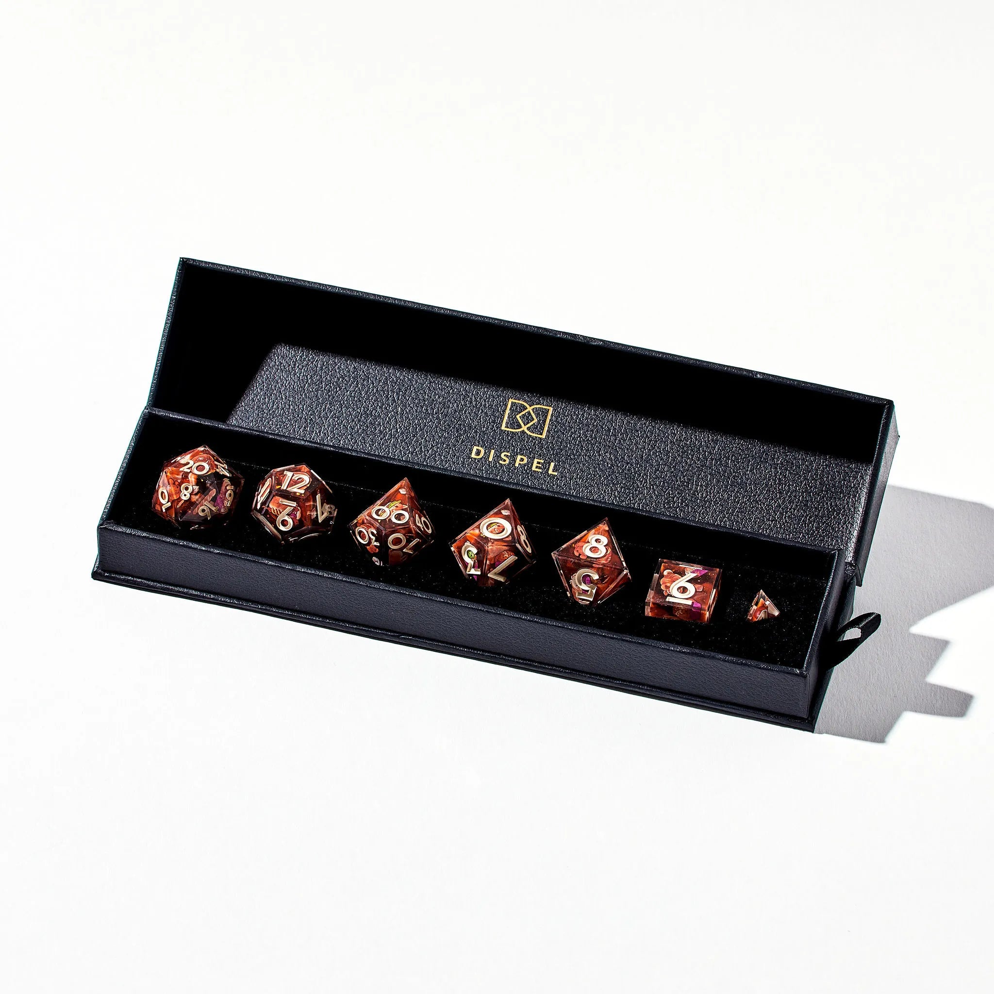 Cream on Brown Colored DnD Dice Set with Pastries that look like Dogs Decorated on all Sides in Packaging