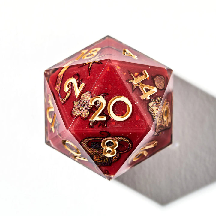 Close up of a red d20 with a otherworldly inspired decals and yellow inked numbers