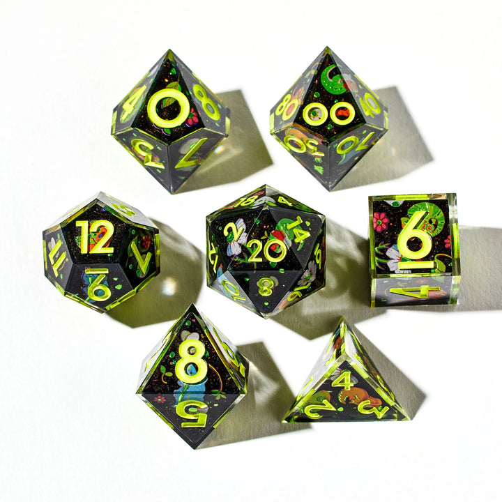 Green on Black DnD Dice Set Decorated with Lizard Designs on a White Background