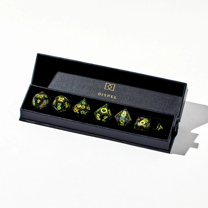Green on Black Dice Set Decorated with Lizard Designs in Packging on a White Background