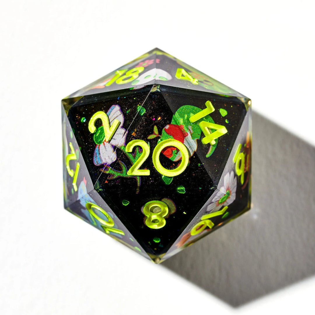 Green on Black D20 Decorated with Lizard Designs on a White Background