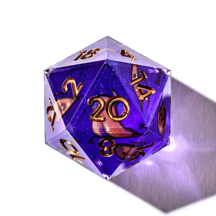 Close up of a purple D20 with mimic like designs