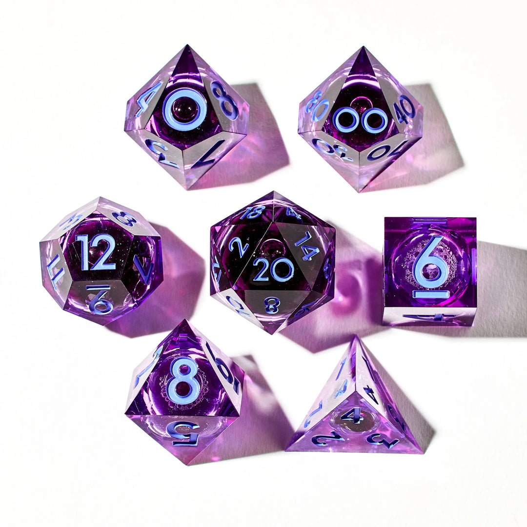 Picture of a full purple DnD set with a liquid core and light blue inked numbers