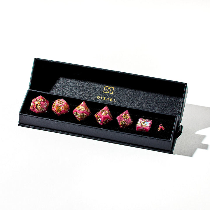 Close up of a red dice set with Japanese art designs in its packaging