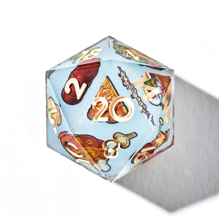 Close up of a D20 die with food from the anime Dungeon Meshi designs on each face